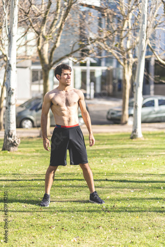 Attractive young man posing in the park after exercising