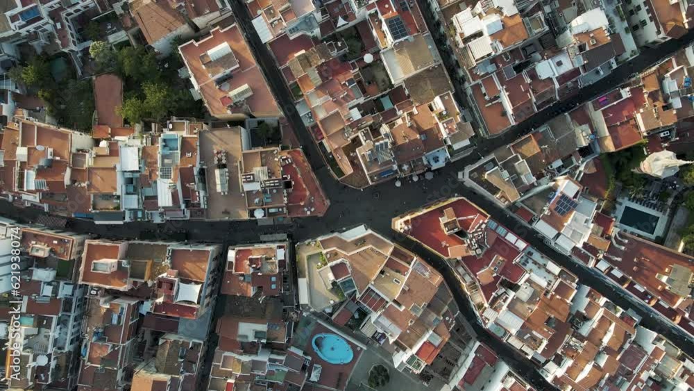 Aerial top down view of Sitges downtown with red rooftops and residential district, Barcelona, Spain. Aerial top down view of Sitges downtown with red rooftops and residential district, Barcelona, Spain.