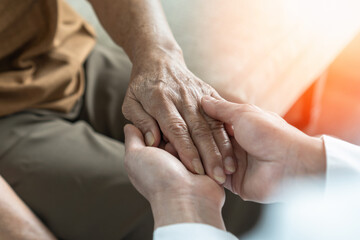 Parkinson disease patient, Alzheimer elderly senior, Arthritis person's hand in support of geriatric doctor or nursing caregiver, for disability awareness day, ageing society care service