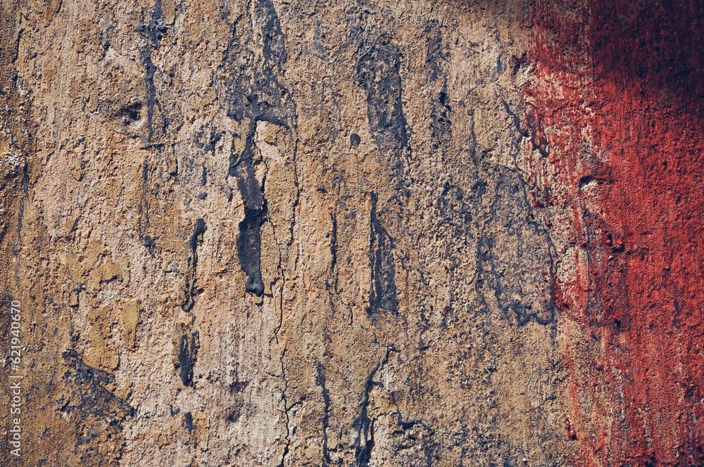 Grey, Abstract background of the shabby concrete wall surface with bright red yellow paint and mossy weathered parts Grey, Abstract background of the shabby concrete wall surface with bright red yellow paint and mossy weathered parts