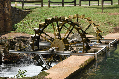An old waterwheel in a park in Tuscumbia, Alabama  photo