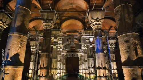 Interior view of the Theodosius cistern in Istanbul, Turkey. A lot of columns, twilight with illumination, pathway photo