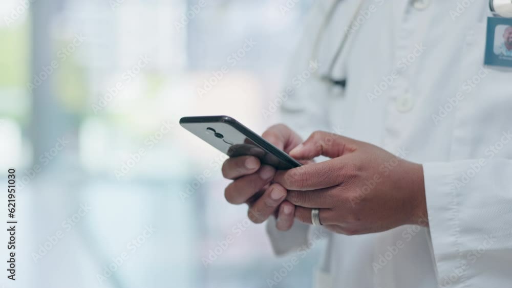 Phone, hands and doctor typing email prescription online, internet or web in a hospital for medical healthcare on mobile app. Professional, closeup and person research medicine or search a website Phone, hands and doctor typing email prescription online, internet or web in a hospital for medical healthcare on mobile app. Professional, closeup and person research medicine or search a website
