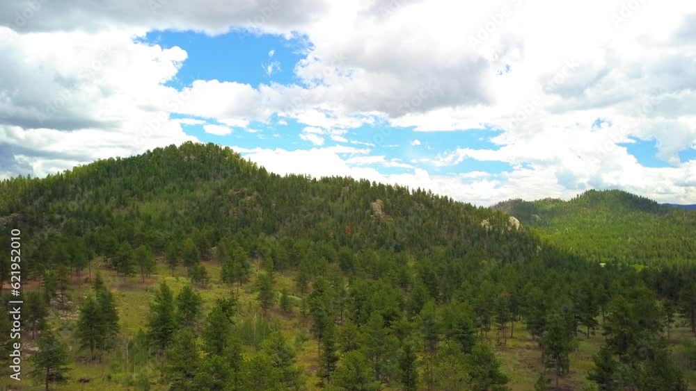 Aerial Shot Of Green Trees On Landscape Against Cloudy Sky, Drone Flying Backward Over State Park - Eleven Mile State Park, Colorado Aerial Shot Of Green Trees On Landscape Against Cloudy Sky, Drone Flying Backward Over State Park - Eleven Mile State Park, Colorado