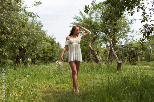 Walk with a woman in an apple orchard