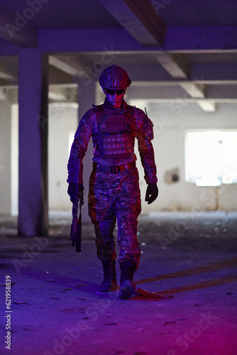 A professional soldier undertakes a perilous mission in an abandoned building illuminated by neon blue and purple lights © .shock