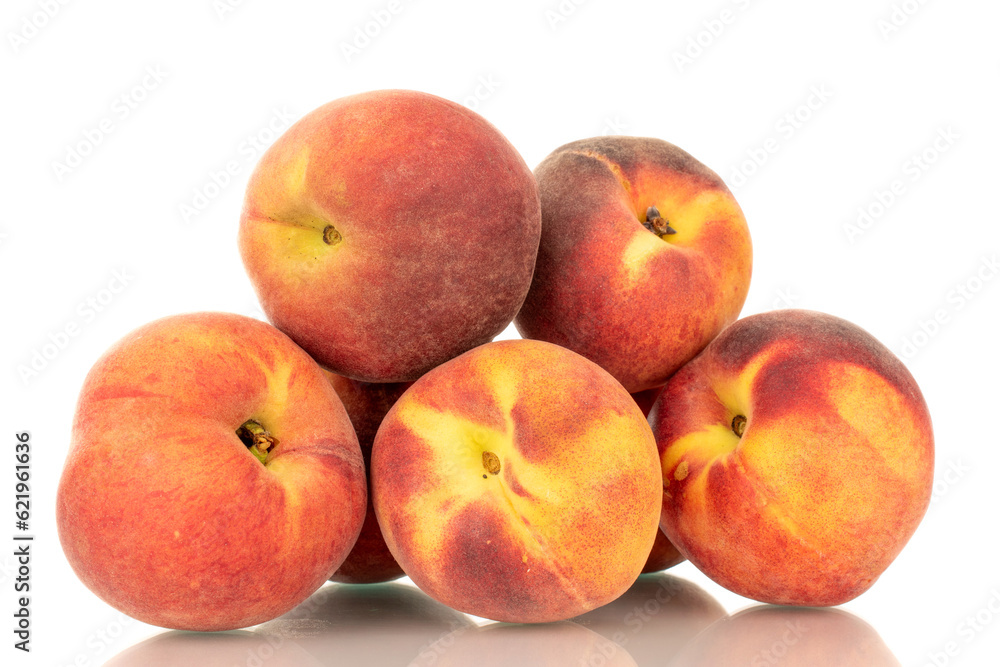 Several ripe organic peaches, macro, isolated on white background. Several ripe organic peaches, macro, isolated on white background.