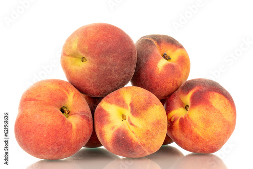 Several ripe organic peaches, macro, isolated on white background.