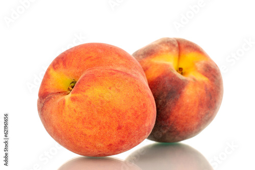 Two ripe organic peaches, macro, isolated on white background.