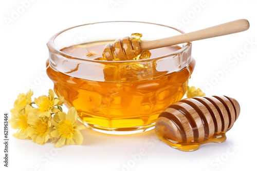 Honeycomb and honey in glass bowl and spoon, flower isolated on white background