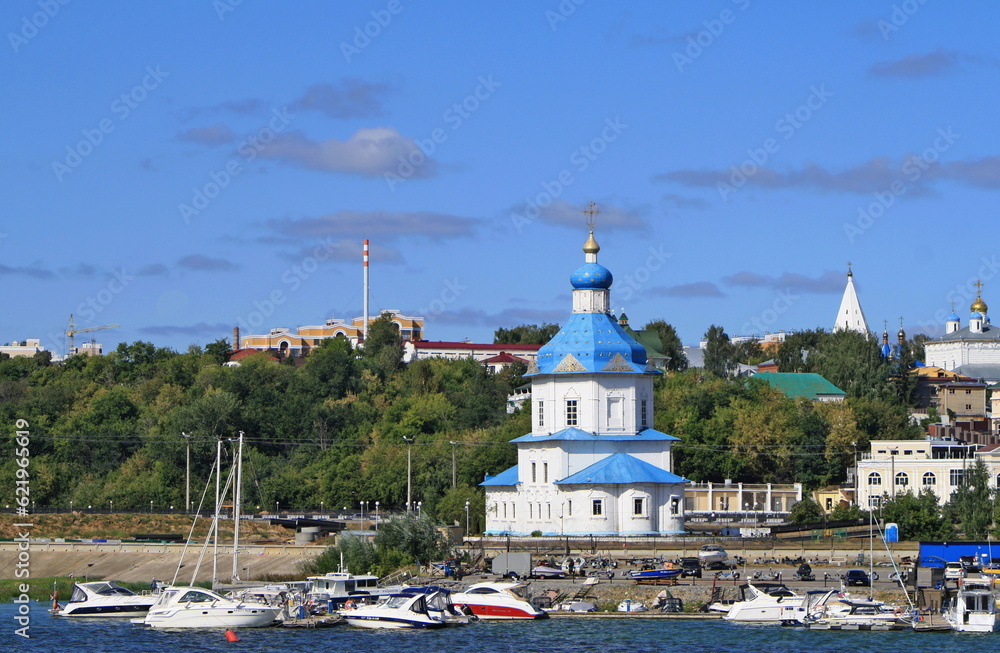 Russia, Republic of Chuvashia, Cheboksary, August 2021: Church of the Assumption of the Blessed Virgin Mary and view of Cheboksary Bay