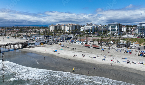 Tableau sur toile Oceanside, California, looking at the  Downtown on the Beach with the Pier in th