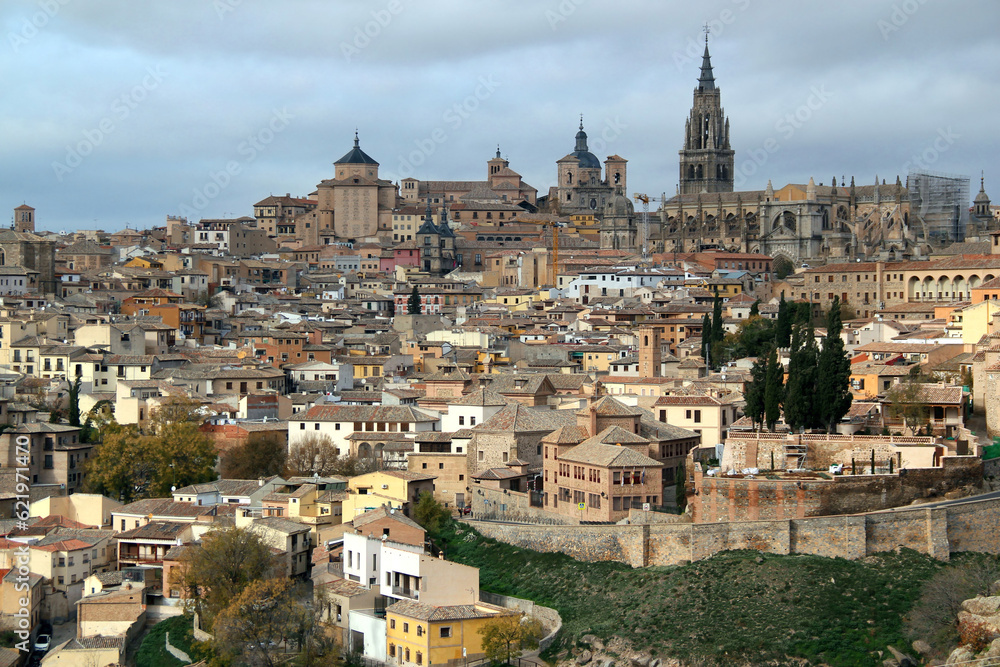 Panoramic view of the historic part of the city with the Cathedral of Toledo in the center of the photo against a stormy sky in the city of Toledo, near Madrid, Spain