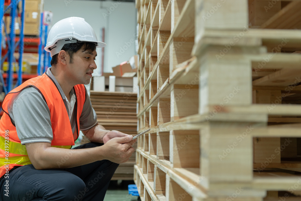 Asian male factory inspect pallet in warehouse or inventory and check stock product. Transport logistic business shipping, delivery to customers. inspection, storehouse, storage, factory Asian male factory inspect pallet in warehouse or inventory and check stock product. Transport logistic business shipping, delivery to customers. inspection, storehouse, storage, factory
