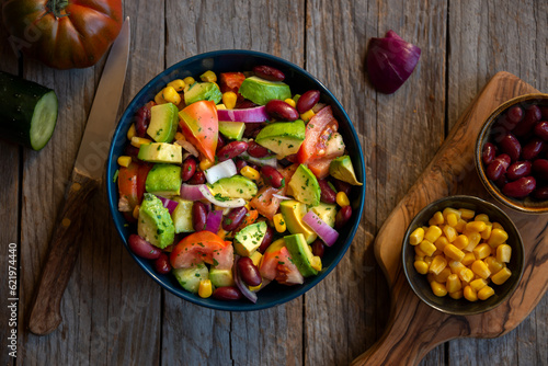 Avocado salad with other vegetables, tomatoes and corn. Healthy food