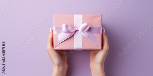 Female hands holding gift box. Copy space. Christmas, hew year, birthday concept, generative ai 