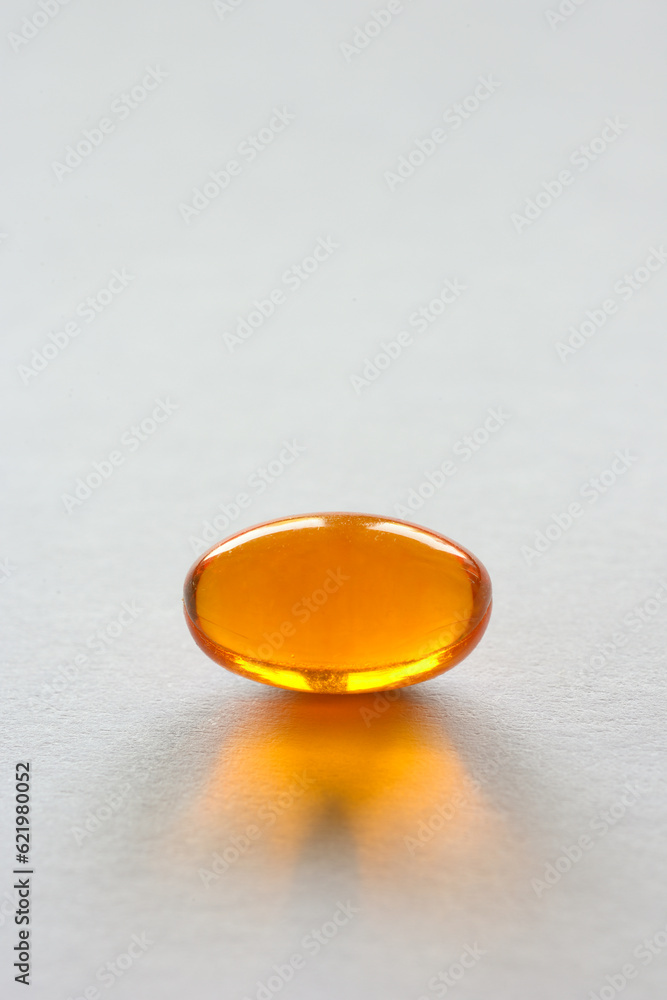 Detail of orange pills in packaging and isolated Detail of orange pills in packaging and isolated