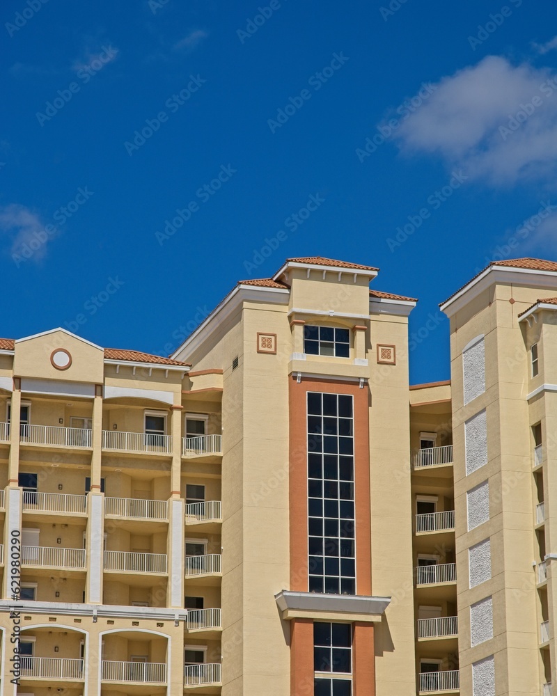 High-rise condominium building set against bright blue skies