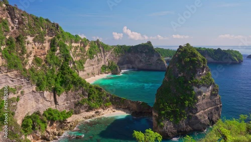 Diamond Beach Bali with scenery lagoon, sand beach and mountain cliff in ocean on nature background Bali Indonesia 4K photo