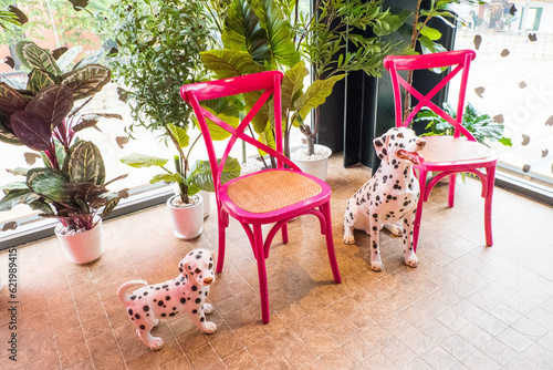 A Dalmatian dog toy with black spots for decoration at home.