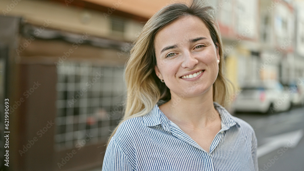 Young blonde woman smiling confident standing at coffee shop terrace Young blonde woman smiling confident standing at coffee shop terrace