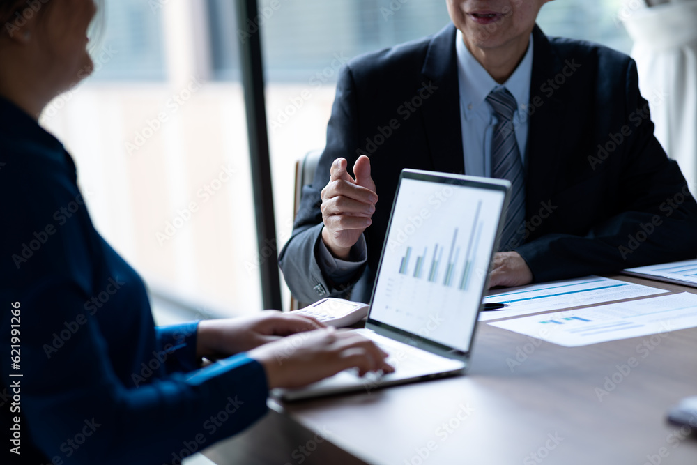 businessman giving a business lecture to a young businesswoman in business businessman giving a business lecture to a young businesswoman in business