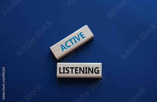 Active listening symbol. Wooden blocks with words Active listening. Beautiful deep blue background. Business and Active listening concept. Copy space.