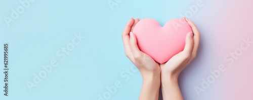 Hands in shape of heart  pastel background  concept of friendship and love  panorama. Generative Ai.