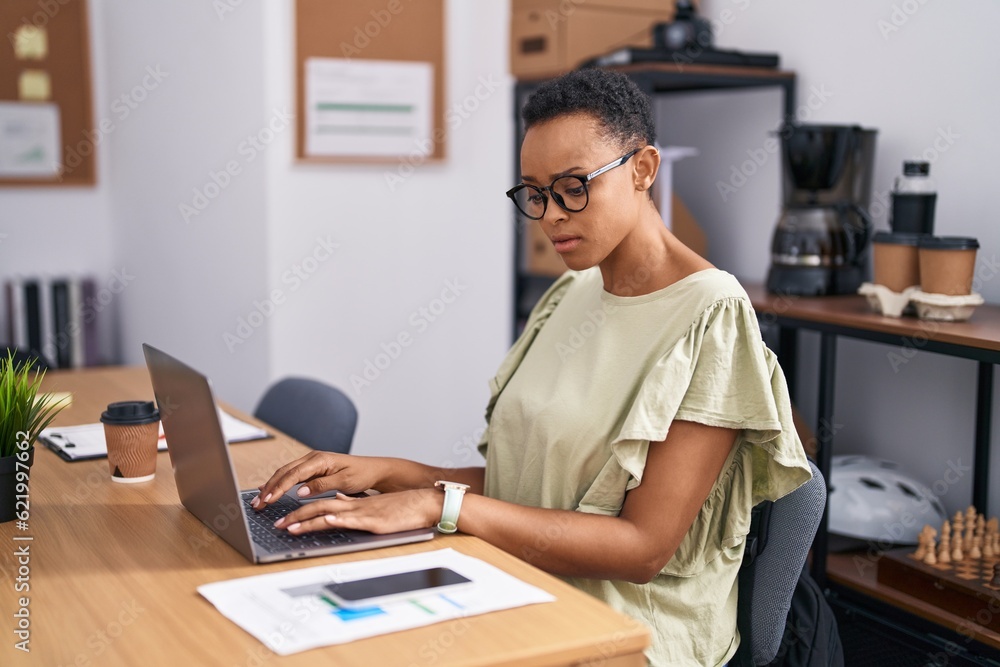 African american woman business worker using laptop working at office African american woman business worker using laptop working at office