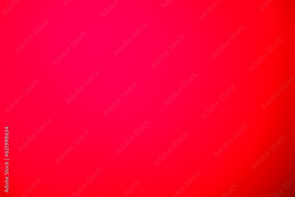 Bright pink and red background in the center, like a wrinkled fabric, then gradient towards the dark edges