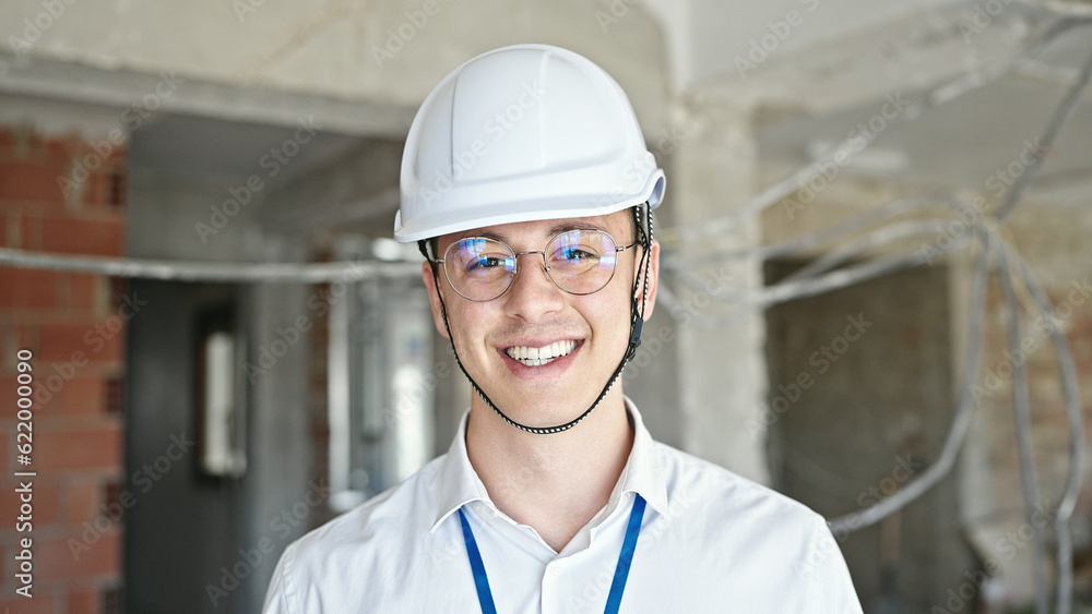 Young hispanic man architect smiling confident standing at construction site Young hispanic man architect smiling confident standing at construction site