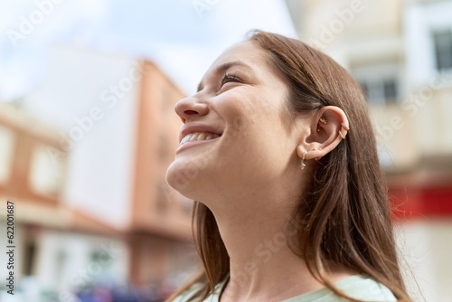 Young beautiful woman smiling confident talking on the smartphone at street
