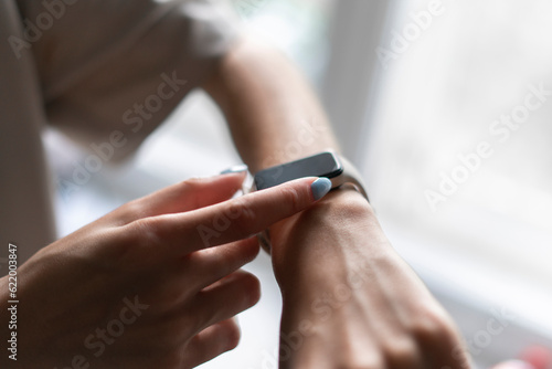 girl using smart watch to check her health