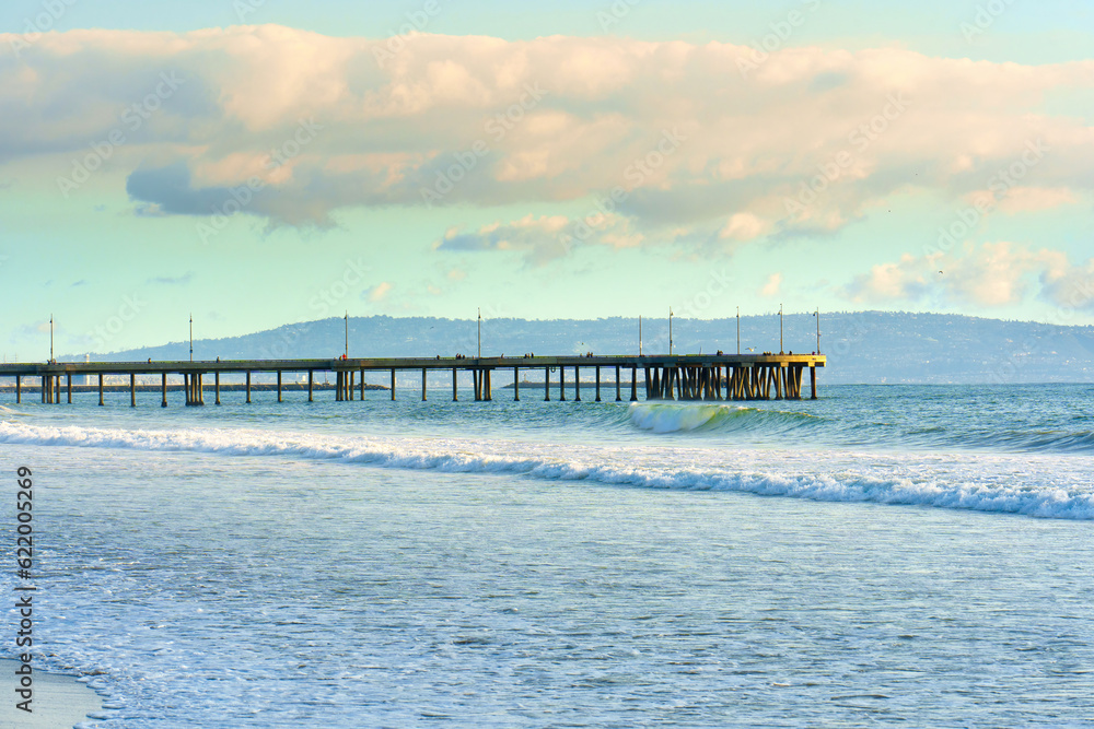 Scenic View of Venice Beach Pier with Waves and Clouds Scenic View of Venice Beach Pier with Waves and Clouds