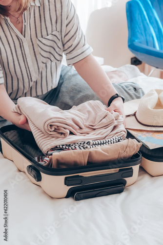 Travel.Suitcase.Girl traveler packing luggage in suitcase Travel,tourism,vacation,relocation.Mental health twellness,travel vacation.Unity, eco travel,travelling,good moments, digital detox