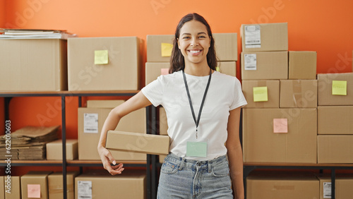 African american woman ecommerce business worker smiling confident holding package at office © Krakenimages.com