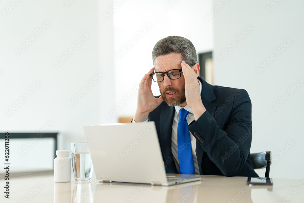 frustrated man manager has pain and fatigue. photo of man manager has pain and fatigue. frustrated man manager has pain and fatigue. photo of man manager has pain and fatigue.