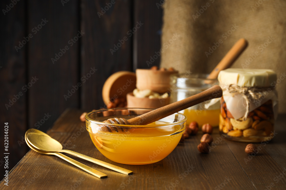 Concept of tasty and sweet food - honey with nuts Concept of tasty and sweet food - honey with nuts