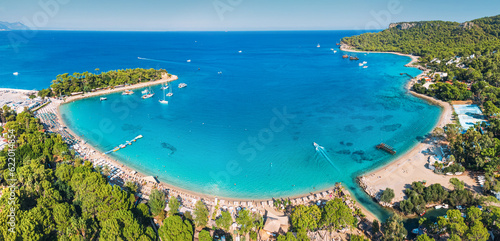 aerial paradise view  showcasing an idyllic harbor adorned with luxurious yachts and green forest in Kemer  Turkey