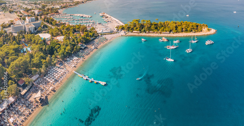 Fototapeta Naklejka Na Ścianę i Meble -  aerial paradise view, showcasing an idyllic harbor adorned with luxurious yachts and green forest in Kemer, Turkey