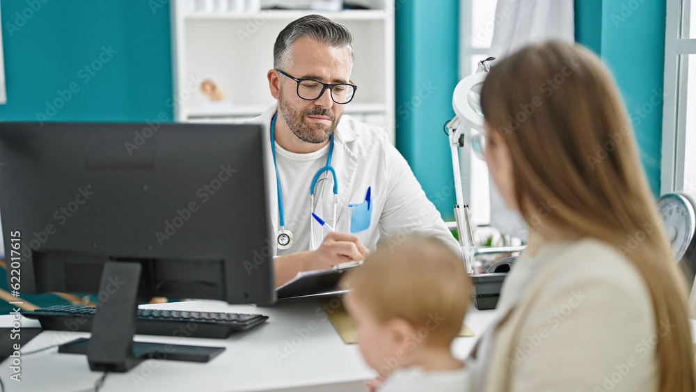 Caucasian mother with baby on a doctor appointment at clinic