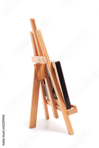 Artist wooden easel with canvas isolated on white