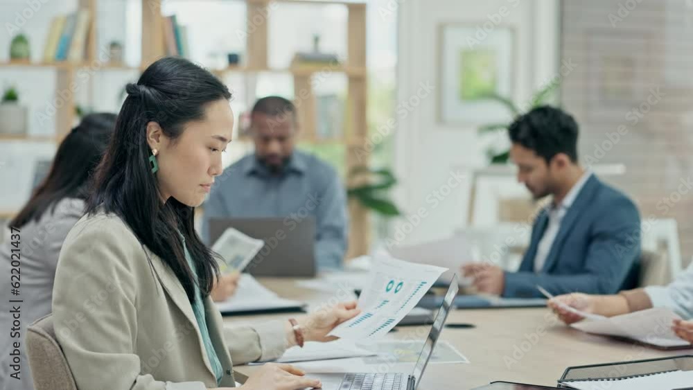 Business woman, meeting and statistics notes for finance analysis in a office. Conference room, Asian female person and reading a budget review and accounting report with staff for a project