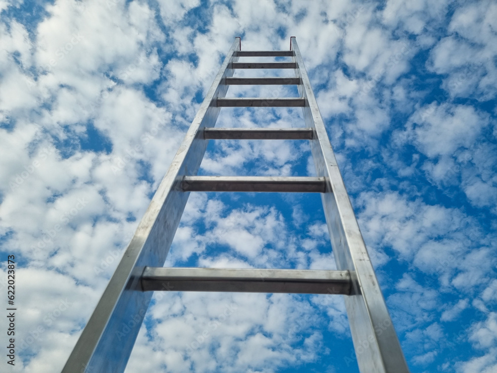Blue sky with clouds and ladder, way to success concept
Blue sky with clouds and ladder, way to success concept