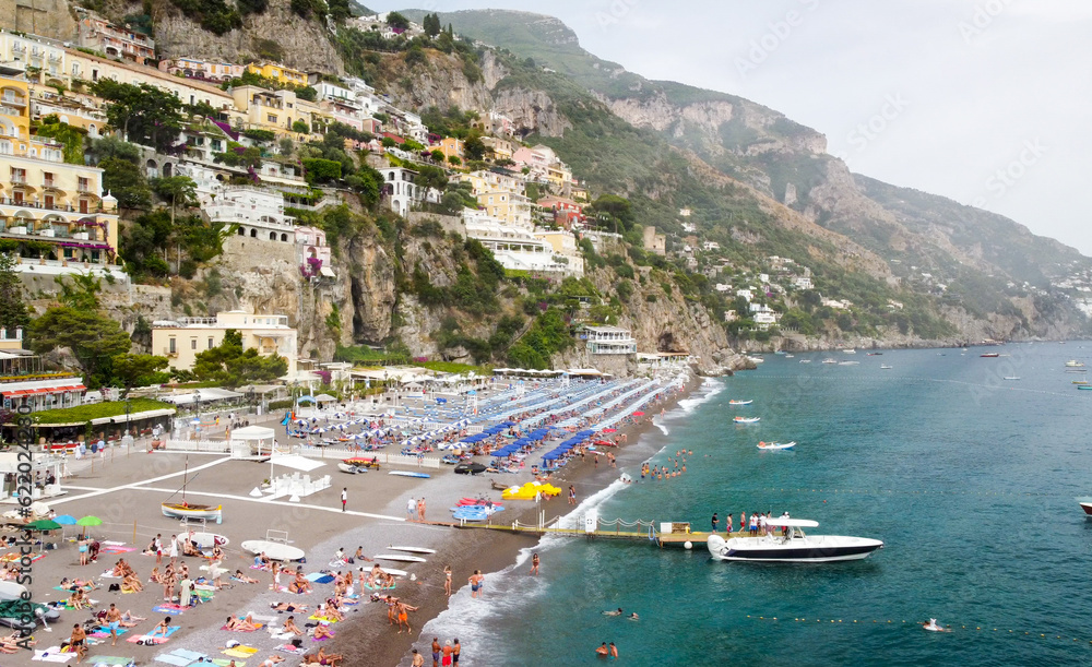 Panoramic aerial view of Positano coastline from a moving drone, Campania - Italy.
