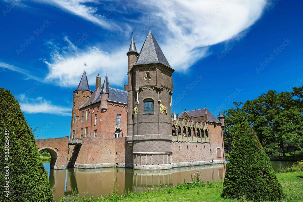Beautiful dutch fairy tale water castle in green idyllic scenic landscape - Kasteel Heeswijk, Netherlands, Noord-Brabant