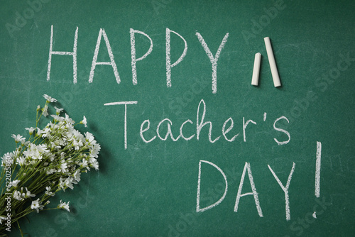 Happy teacher's day greetings, inscription on a green board