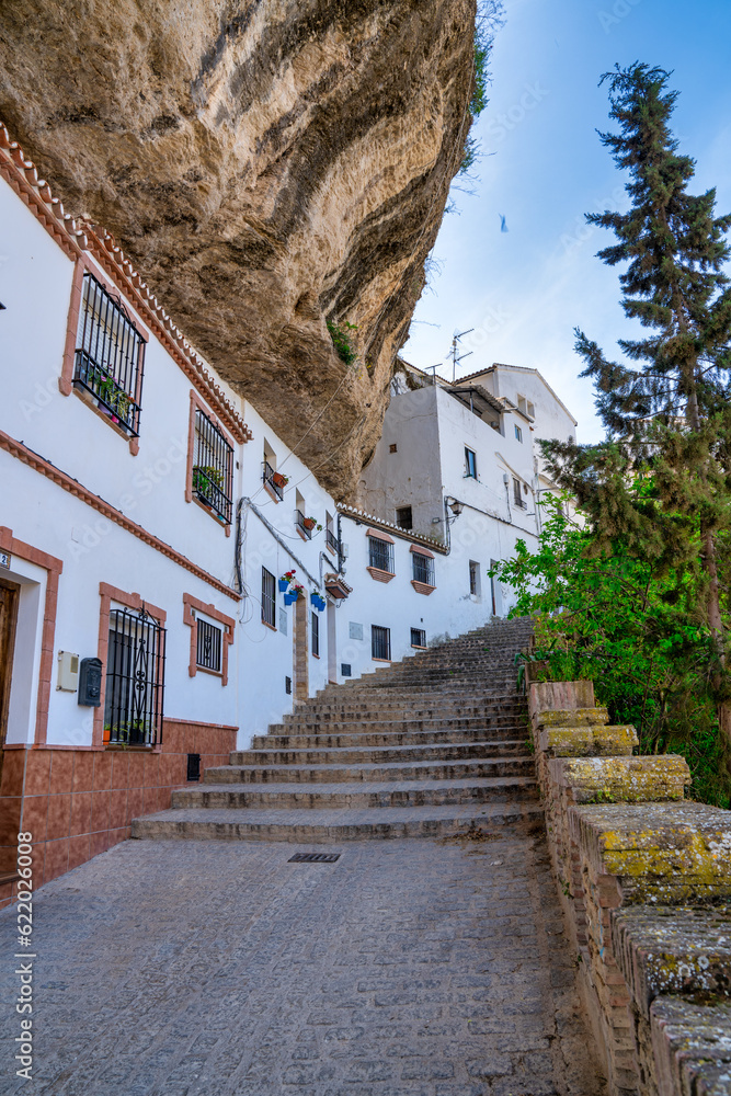 Setenil de las Bodegas. Typical Andalucian village with white houses and sreets with dwellings built into rock overhangs above Rio Trejo