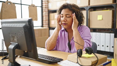 Young beautiful latin woman ecommerce business worker using computer stressed at office