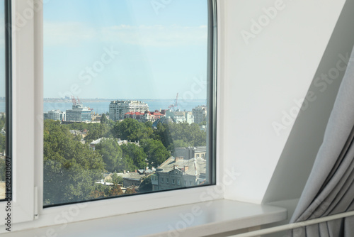 A window with a view of the city in the apartment